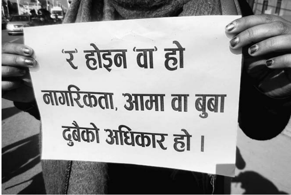 Figure 3 The protester’s sign reads “No to and, yes to or! Both fathers and mothers have the right to give citizenship.” Photo: Dannah Dennis